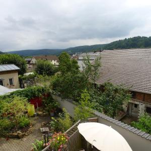 an overhead view of a garden with an umbrella at Ferienhaus 13b in Bad Orb