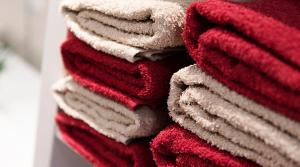 a pile of red and white towels stacked at Haus Haslauer in Strobl +33 photos