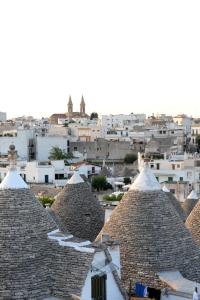 a view of roofs of buildings in a city at Agriturismo Laire Masseria in Alberobello