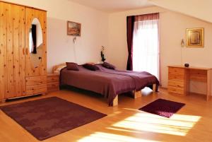 Posteľ alebo postele v izbe v ubytovaní Hungaria Apartments