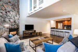 a living room with a couch and a fireplace at Evergreen Lodge at Vail in Vail