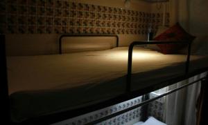 a bed in a small room with at First IN in Madgaon