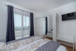 Postel nebo postele na pokoji v ubytování Villa Confido Luxury Apartment 01 + 37 fotografií