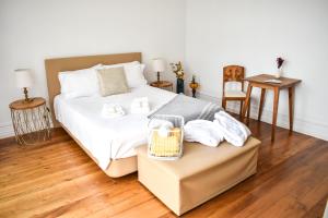Een bed of bedden in een kamer bij A Casa da Cascata