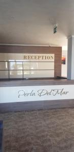 a sign for a fashion store in a mall at Perla Del Mar Aparthotel in Lozenets +52 photos