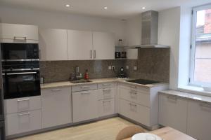 A kitchen or kitchenette at Aux Portes du Beaujolais