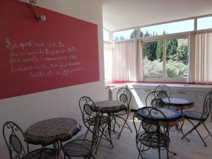a group of chairs and tables in a room at B&B Catanzaro lido La collina dei poeti in Catanzaro Lido