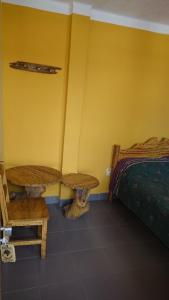 Postel nebo postele na pokoji v ubytování Hostal Coronel Pedro Arraya