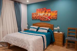 Posteľ alebo postele v izbe v ubytovaní Hostal Tribal
