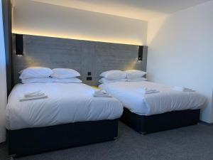 Katil atau katil-katil dalam bilik di Motel Air Glasgow Airport