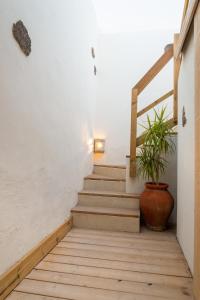 a staircase leading up to a room with a balcony at El Hotelito del Cotillo in Cotillo