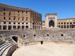 an amphitheater in a city with buildings in the background at Casa Midori in Lecce