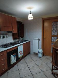 a kitchen with a stove and a stove top oven at Casa 900 in Pompei