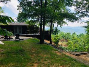 a house with a view of the mountains at Pop’s Cottage in Bryson City