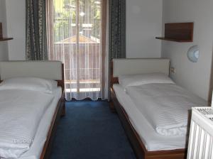 Cama o camas de una habitación en Ferienwohnungen Pitterle
