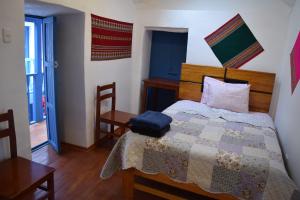 Postel nebo postele na pokoji v ubytování Carlos Guest House 3 Cusco