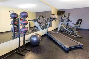 a gym with several exercise bikes and a mirror at Days Inn by Wyndham Grantville in Grantville