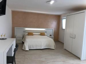 Ένα ή περισσότερα κρεβάτια σε δωμάτιο στο le terrazze sul mare gallipoli centro