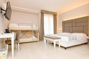 Posteľ alebo postele v izbe v ubytovaní Hotel Oliveto