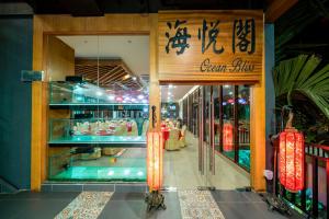 a store front of a store with a sign on it at Aman Tioman Beach Resort in Tioman Island