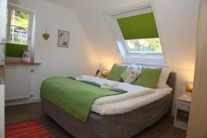 A bed or beds in a room at Hotel-Berggasthof Schwarzwaldperle