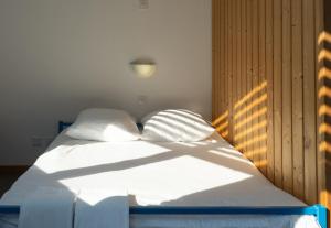Voodi või voodid majutusasutuse Mont-Fort Swiss Lodge toas