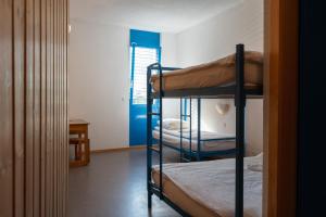Voodi või voodid majutusasutuse Mont-Fort Swiss Lodge toas