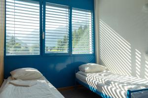 Voodi või voodid majutusasutuse Mont-Fort Swiss Lodge toas