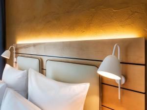 Postel nebo postele na pokoji v ubytování Walhalla Hotel Regensburg Hoeferer 4 Sterne Superior