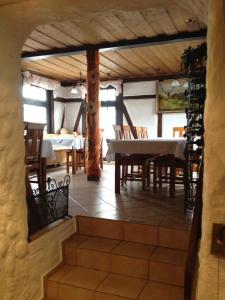 a dining room with a table and some chairs and a table and chairsktop at Hotel-Restaurant Walkmühle in Usingen