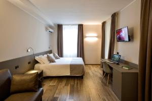 TV a/nebo společenská místnost v ubytování Hotel Baia di Paré