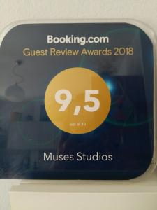 a sign that says guest review awards on a display at Muses Studios Sami in Sami