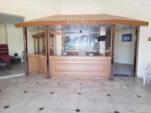a kiosk with a large screen in a room at Hotel Lakeview in Bhuj