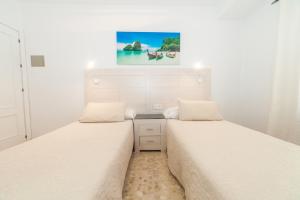 Tempat tidur dalam kamar di Alborada