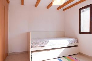 Postel nebo postele na pokoji v ubytování Sonora Aircon Bungalow 90