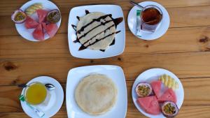 a table topped with plates of food and drinks at Tam Coc Hello Homestay in Ninh Binh +29 photos