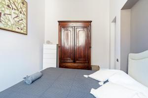 Postel nebo postele na pokoji v ubytování Vittoria Corner - byMyHomeInComo