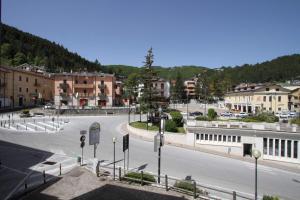 an empty street in a town with buildings at Residenza dei Maestri in Roccaraso