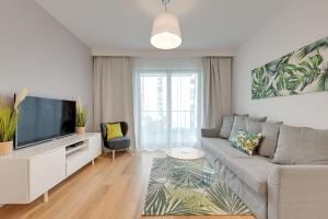Televízia a/alebo spoločenská miestnosť v ubytovaní Wave Apartments - Nadmorze