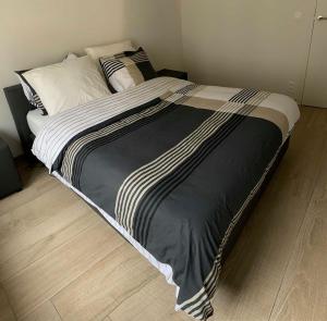 Een bed of bedden in een kamer bij Vitamine Zee