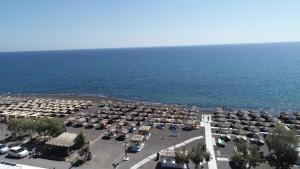 an aerial view of a parking lot next to the ocean at Sea View Beach Hotel in Perivolos
