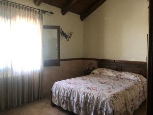Postel nebo postele na pokoji v ubytování Agriturismo La Baita