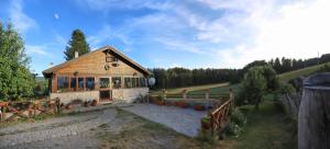 a small house in the middle of a field at Casale dell'Arvo in Lorica