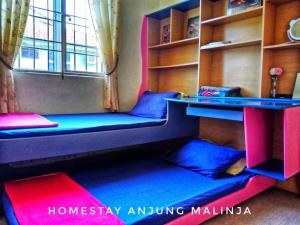 A bed or beds in a room at Homestay Anjung Malinja Private Pool Kedah