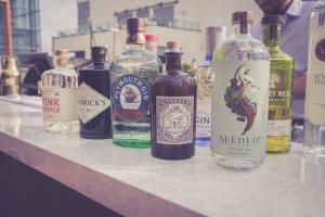 a group of bottles of alcohol sitting on a counter at Waterfront Southport Hotel in Southport