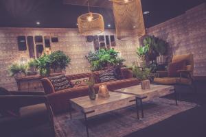 a living room with a couch and a table at Waterfront Southport Hotel in Southport