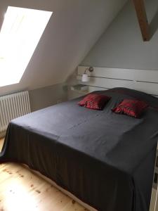 Tempat tidur dalam kamar di Altstadt-Ferienwohnungen Neuruppin