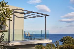 a balcony of a house with a view of the ocean at Villa Blue Sea in Skala