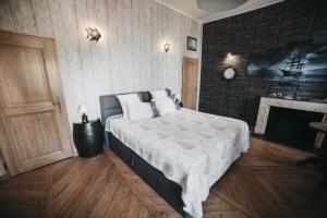 Postel nebo postele na pokoji v ubytování Manoir Le Refuge