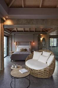a bedroom with a large couch and a bed at Villa Sea front in Skala +16 photos